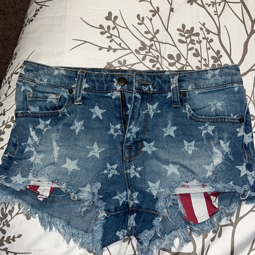 High rise jean shorts, American flag themed with showing pockets